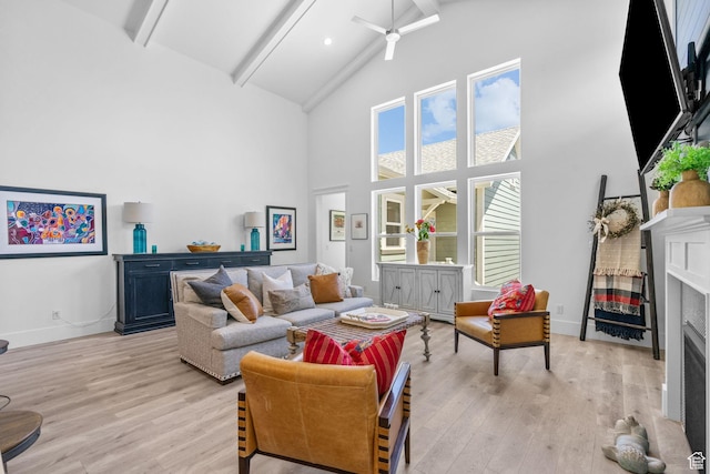 11571 S Skyward Rd W, South Jordan, UT 84009 - living room featuring a fireplace, high vaulted ceiling, beam ceiling, light wood-type flooring, and ceiling fan