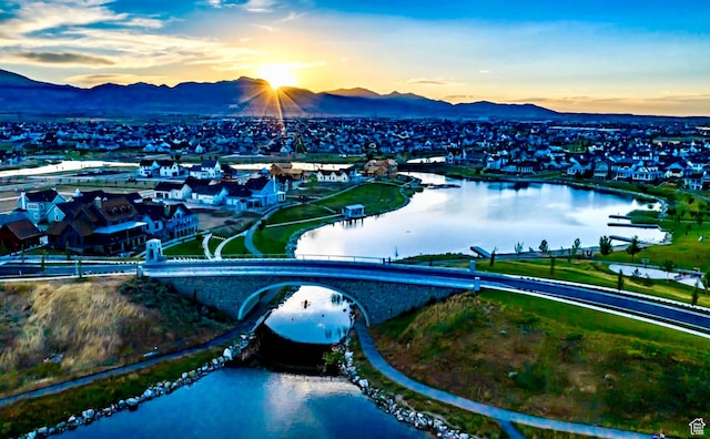 11571 S Skyward Rd W, South Jordan, UT 84009 - aerial view at dusk of a water and mountain view, a residential view, and a notable bridge
