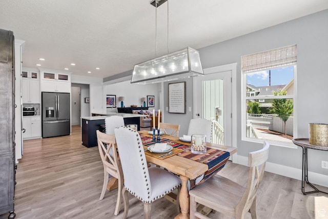 11571 S Skyward Rd W, South Jordan, UT 84009 - dining space featuring light wood-style floors and recessed lighting