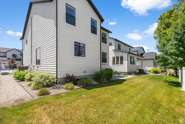 22 W Orchard Ln Unit 202, Bountiful, UT 84010 - back of property featuring a yard