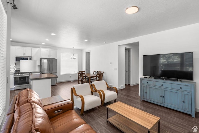 22 W Orchard Ln Unit 202, Bountiful, UT 84010 - living area with recessed lighting, dark wood-style flooring, and a chandelier