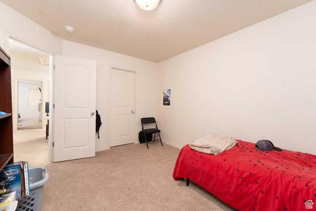 392 E 700 S Unit H, Vernal, UT 84078 - bedroom with light colored carpet and a textured ceiling