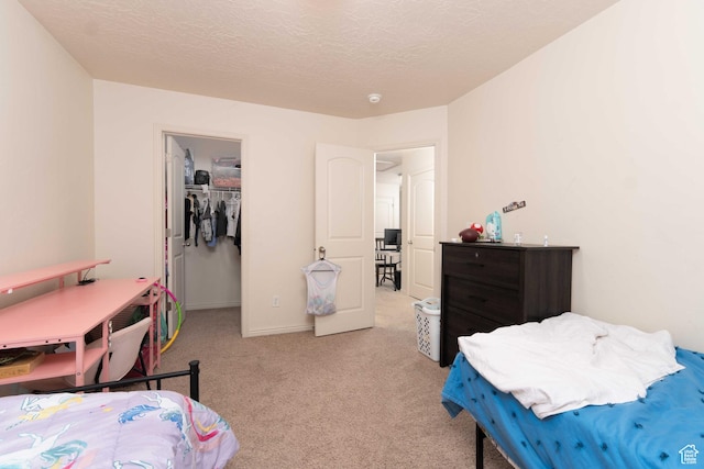 392 E 700 S Unit H, Vernal, UT 84078 - carpeted bedroom with a spacious closet, a textured ceiling, and a closet