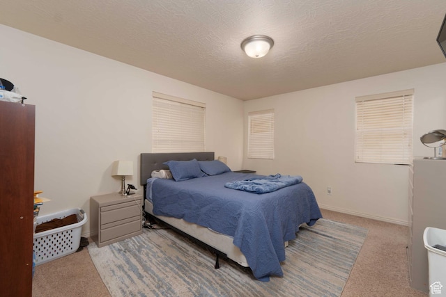 392 E 700 S Unit H, Vernal, UT 84078 - carpeted bedroom featuring baseboards and a textured ceiling