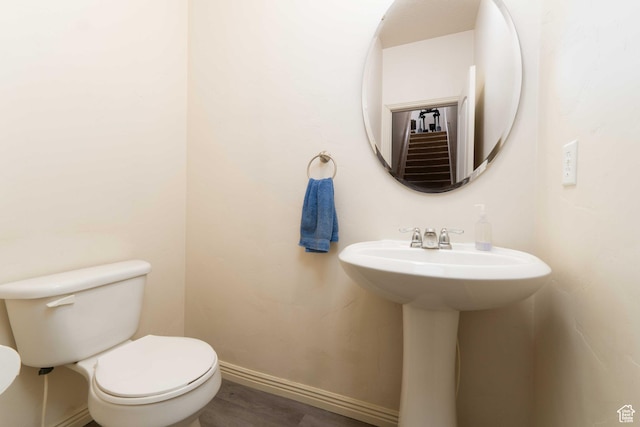 392 E 700 S Unit H, Vernal, UT 84078 - half bathroom with toilet and wood finished floors