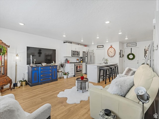 3794 W Orinda Dr, Lehi, UT 84043 - living area featuring light wood-type flooring and recessed lighting