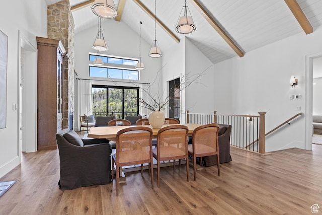 926 E Autumn Dr, Brian Head, UT 84719 - dining space with high vaulted ceiling, beam ceiling, and wood finished floors