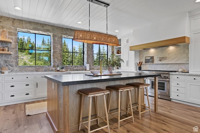 926 E Autumn Dr, Brian Head, UT 84719 - kitchen with high end range, decorative backsplash, white cabinets, recessed lighting, and wooden ceiling