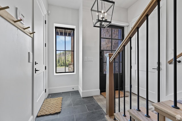926 E Autumn Dr, Brian Head, UT 84719 - entrance foyer featuring dark tile patterned flooring and a chandelier