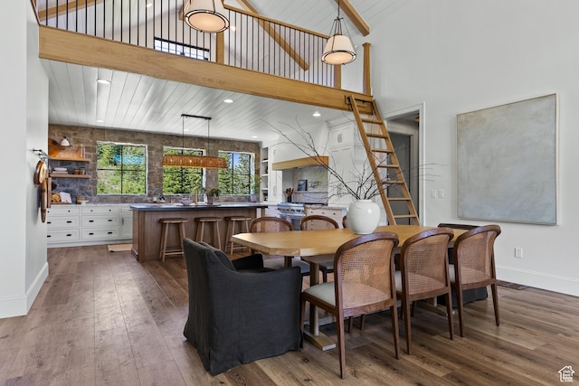 926 E Autumn Dr, Brian Head, UT 84719 - dining space with wood-type flooring, a high ceiling, and recessed lighting