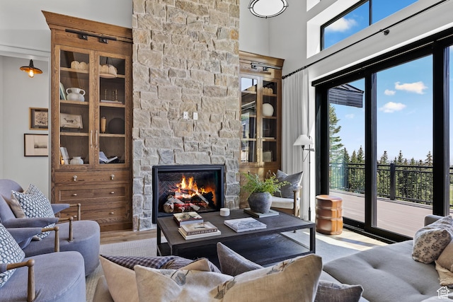 926 E Autumn Dr, Brian Head, UT 84719 - living area featuring a stone fireplace and wood finished floors