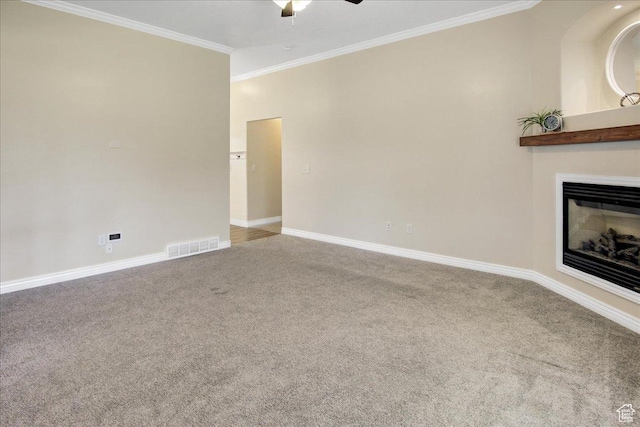 4595 W 1650 N, West Point, UT 84015 - unfurnished living room featuring a ceiling fan, crown molding, carpet floors, and a glass covered fireplace