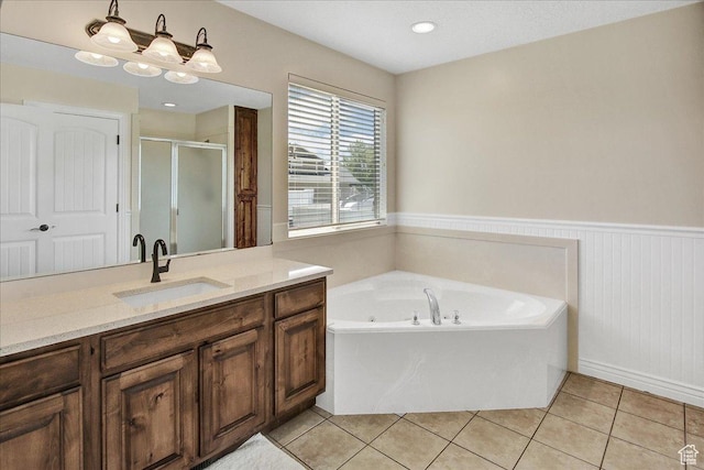 4595 W 1650 N, West Point, UT 84015 - full bath featuring a wainscoted wall, a shower stall, vanity, a garden tub, and tile patterned flooring