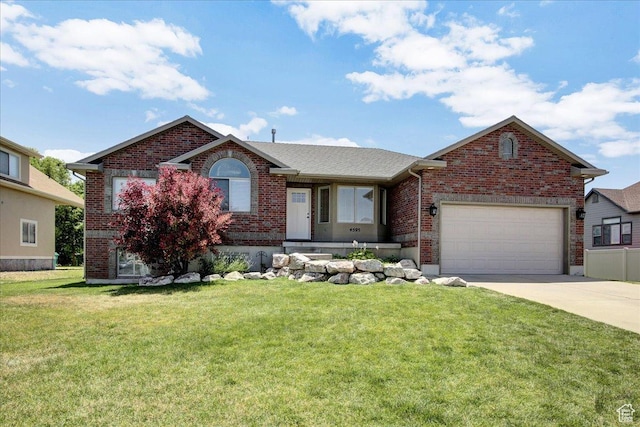 4595 W 1650 N, West Point, UT 84015 - ranch-style house featuring brick siding, driveway, an attached garage, and a front lawn