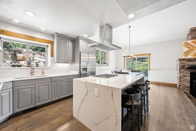 535 Crestview Dr, Park City, UT 84098 - kitchen with gray cabinetry, appliances with stainless steel finishes, island range hood, dark wood-style floors, and recessed lighting