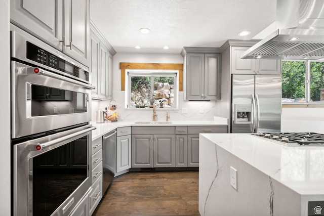 535 Crestview Dr, Park City, UT 84098 - kitchen with gray cabinets, exhaust hood, appliances with stainless steel finishes, healthy amount of natural light, and recessed lighting