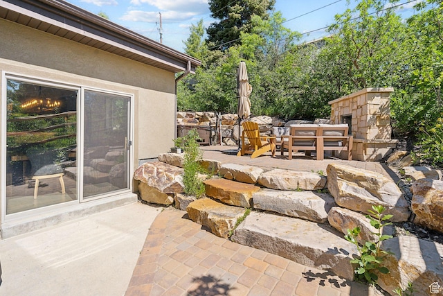 535 Crestview Dr, Park City, UT 84098 - view of patio featuring an outdoor stone fireplace
