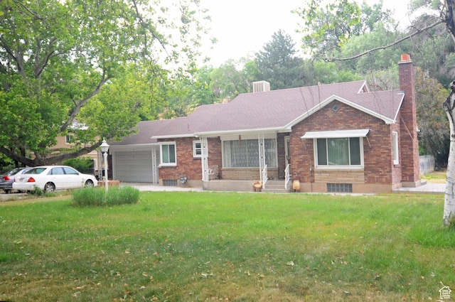 1160 E 12th St S, Ogden, UT 84404 - single story home with brick siding, an attached garage, a front lawn, and a chimney