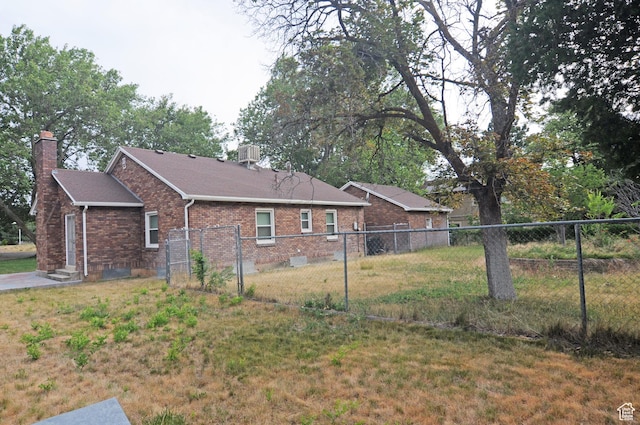 1160 E 12th St S, Ogden, UT 84404 - view of side of property with a chimney, brick siding, and a shingled roof