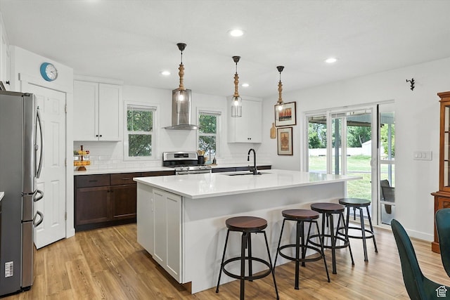 85 S 300 W, Smithfield, UT 84335 - kitchen featuring appliances with stainless steel finishes, light countertops, plenty of natural light, light wood-style flooring, and recessed lighting