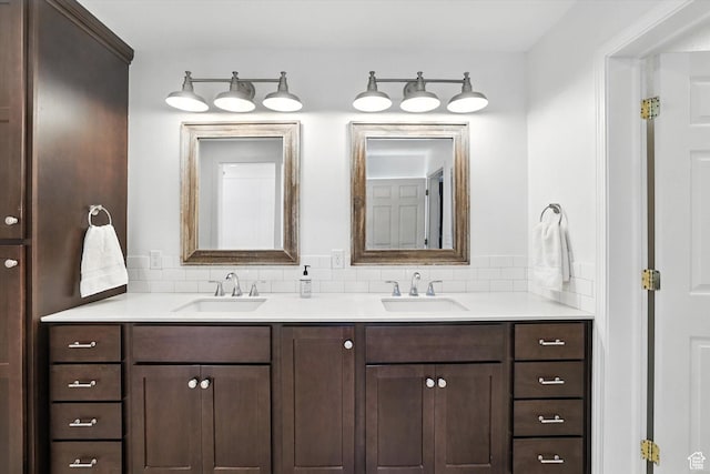 85 S 300 W, Smithfield, UT 84335 - bathroom featuring double vanity and decorative backsplash