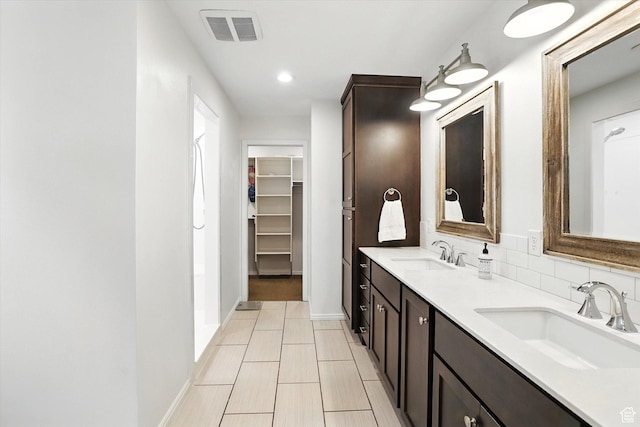 85 S 300 W, Smithfield, UT 84335 - full bathroom with double vanity, a walk in closet, and recessed lighting