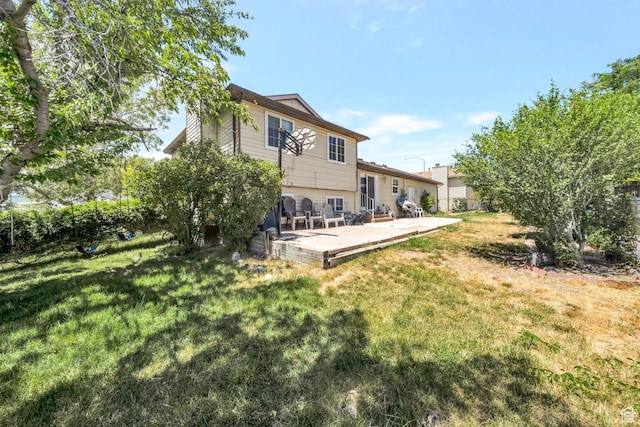 6231 S Westbrook Dr W, Taylorsville, UT 84129 - rear view of house featuring a yard and a patio