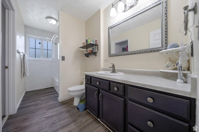 6231 S Westbrook Dr W, Taylorsville, UT 84129 - bathroom featuring vanity, bathing tub / shower combination, and wood finished floors