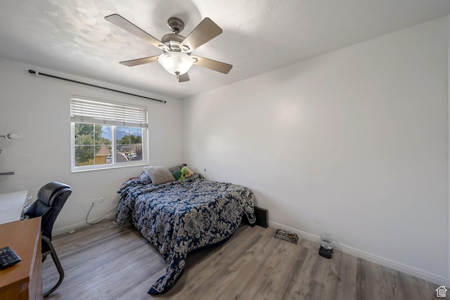 6231 S Westbrook Dr W, Taylorsville, UT 84129 - bedroom featuring wood finished floors, a ceiling fan, and an office area