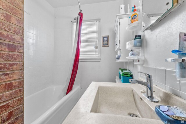 150 S 100 W, Tooele, UT 84074 - full bathroom featuring a sink and shower / bathtub combination with curtain