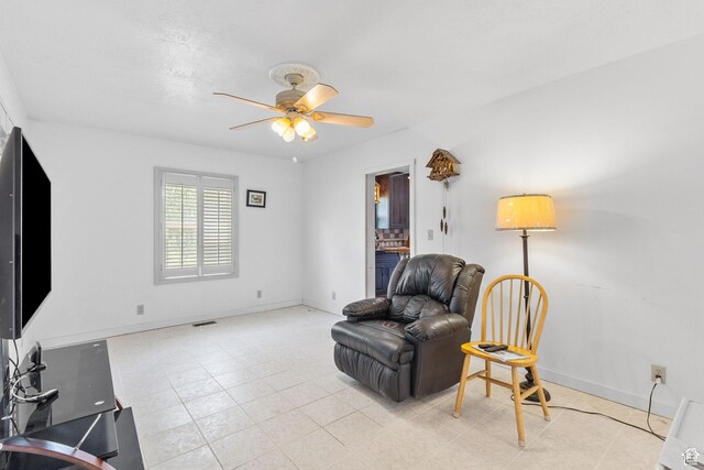 150 S 100 W, Tooele, UT 84074 - living area featuring ceiling fan and baseboards