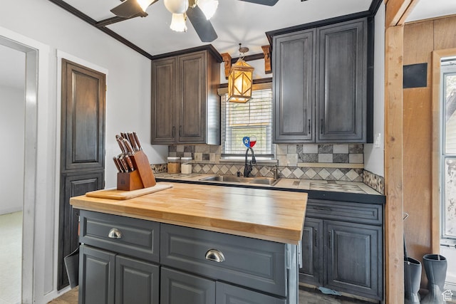 150 S 100 W, Tooele, UT 84074 - kitchen with butcher block counters, ceiling fan, and backsplash