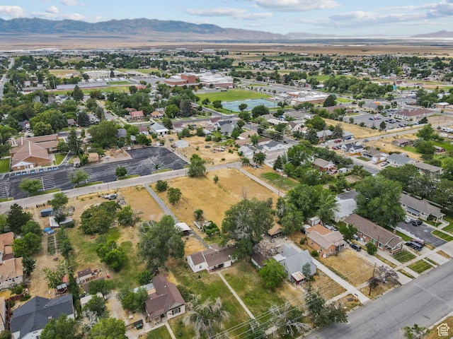 150 S 100 W, Tooele, UT 84074 - aerial view of property and surrounding area with mountains and nearby suburban area
