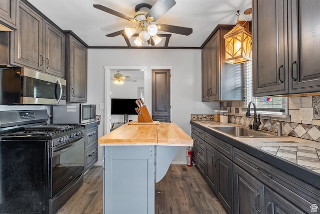150 S 100 W, Tooele, UT 84074 - kitchen featuring black gas range, a ceiling fan, stainless steel microwave, dark wood-style flooring, and crown molding