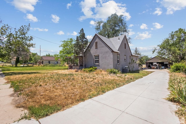 150 S 100 W, Tooele, UT 84074 - view of property exterior with stucco siding and driveway
