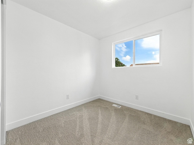 4912 W Seneca Rd S, West Valley City, UT 84120 - spare room featuring baseboards and carpet floors