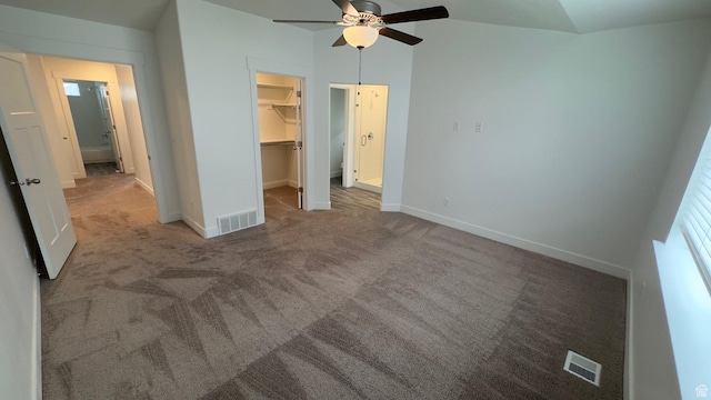 427 E 340 N, Vineyard, UT 84059 - unfurnished bedroom featuring a walk in closet, carpet, a closet, and a ceiling fan