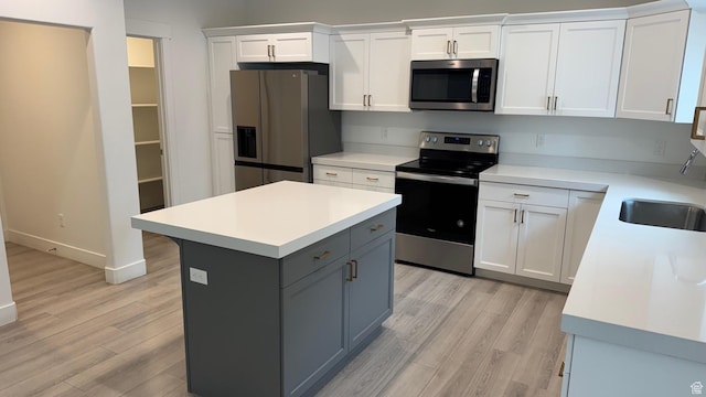 427 E 340 N, Vineyard, UT 84059 - kitchen with stainless steel appliances, light wood-type flooring, light countertops, and white cabinets