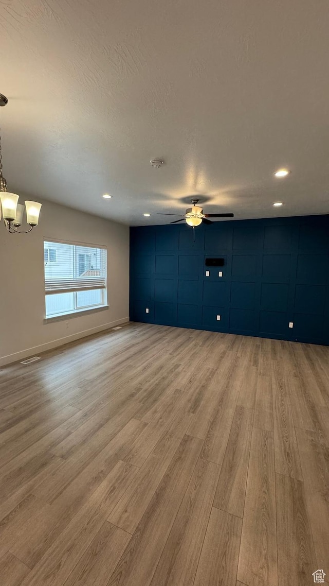 427 E 340 N, Vineyard, UT 84059 - unfurnished living room featuring light wood-type flooring, a ceiling fan, a chandelier, and recessed lighting