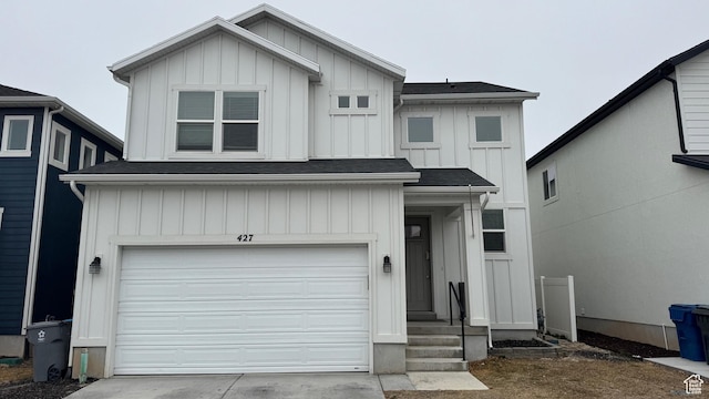 427 E 340 N, Vineyard, UT 84059 - view of front of property with board and batten siding, a garage, concrete driveway, and roof with shingles