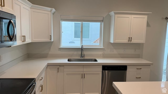 427 E 340 N, Vineyard, UT 84059 - kitchen featuring dishwasher, white cabinets, and light countertops