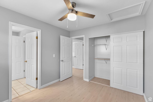 2039 E Rainbow Point Dr, Holladay, UT 84124 - unfurnished bedroom featuring wood finished floors, a closet, attic access, and ceiling fan