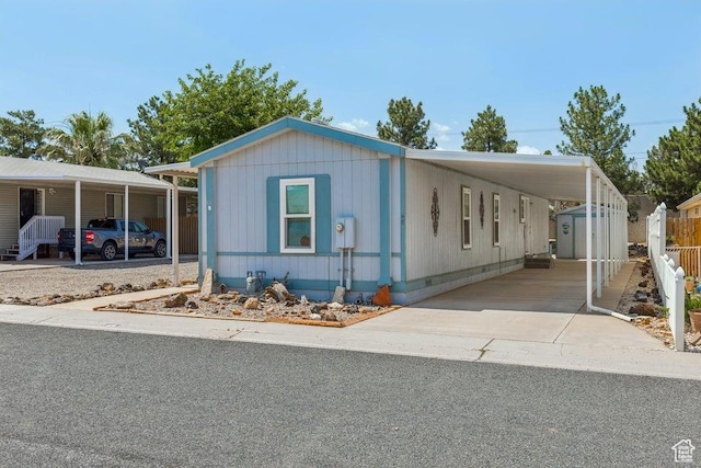 4400 W State St Unit 48, Hurricane, UT 84737 - manufactured / mobile home featuring an attached carport, concrete driveway, and crawl space