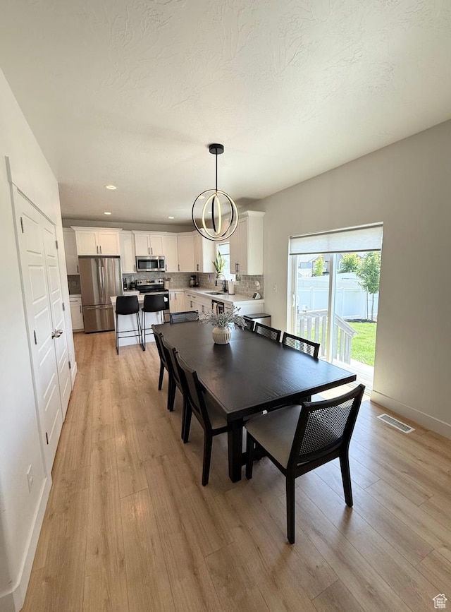 1258 E Bell Buoy Way, Eagle Mountain, UT 84005 - dining room featuring light wood-style floors and recessed lighting