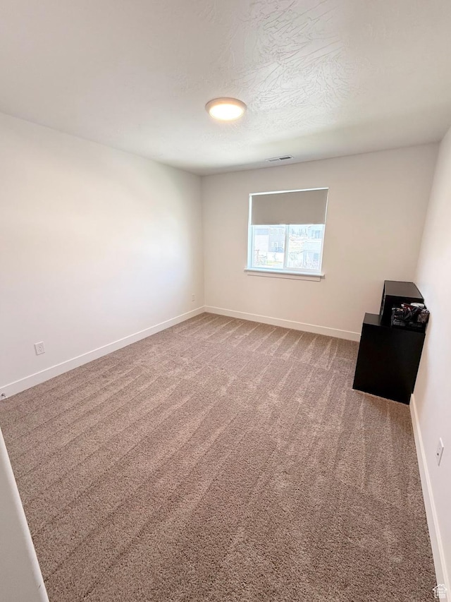 1258 E Bell Buoy Way, Eagle Mountain, UT 84005 - carpeted spare room with baseboards and a textured ceiling