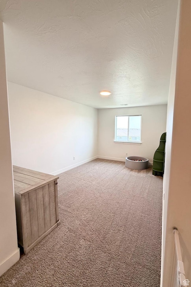 1258 E Bell Buoy Way, Eagle Mountain, UT 84005 - carpeted spare room featuring baseboards and a textured ceiling