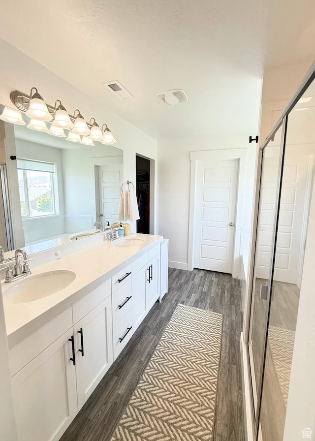 1258 E Bell Buoy Way, Eagle Mountain, UT 84005 - full bath with a stall shower, wood finished floors, double vanity, and a garden tub