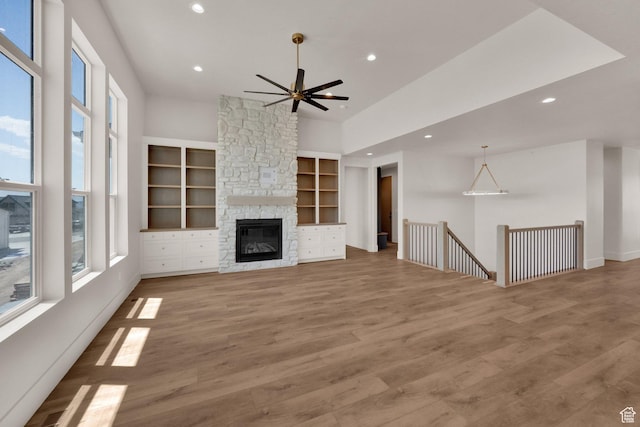 761 W 880 N, American Fork, UT 84003 - unfurnished living room with plenty of natural light, recessed lighting, ceiling fan, built in features, and wood finished floors