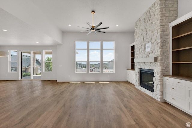 761 W 880 N, American Fork, UT 84003 - unfurnished living room featuring a fireplace, a ceiling fan, light wood finished floors, and recessed lighting