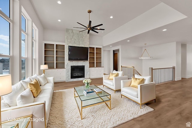 761 W 880 N, American Fork, UT 84003 - living room featuring a ceiling fan, recessed lighting, wood finished floors, a fireplace, and a towering ceiling